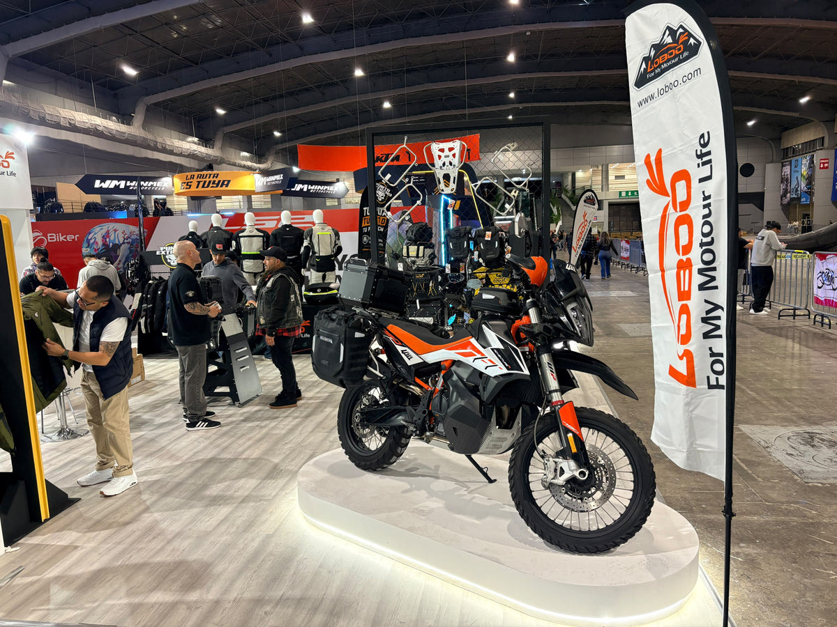 LOBOO booth at SIMM Mexico 2026 with KTM adventure motorcycle and LOBOO banner on display